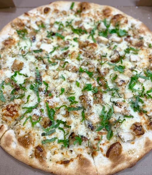 White pizza with fresh basil