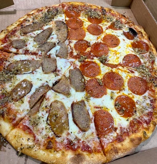 Half sausage, half pepperoni pizza