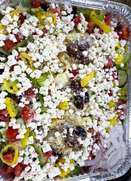 Greek salad catering tray with feta and banana peppers